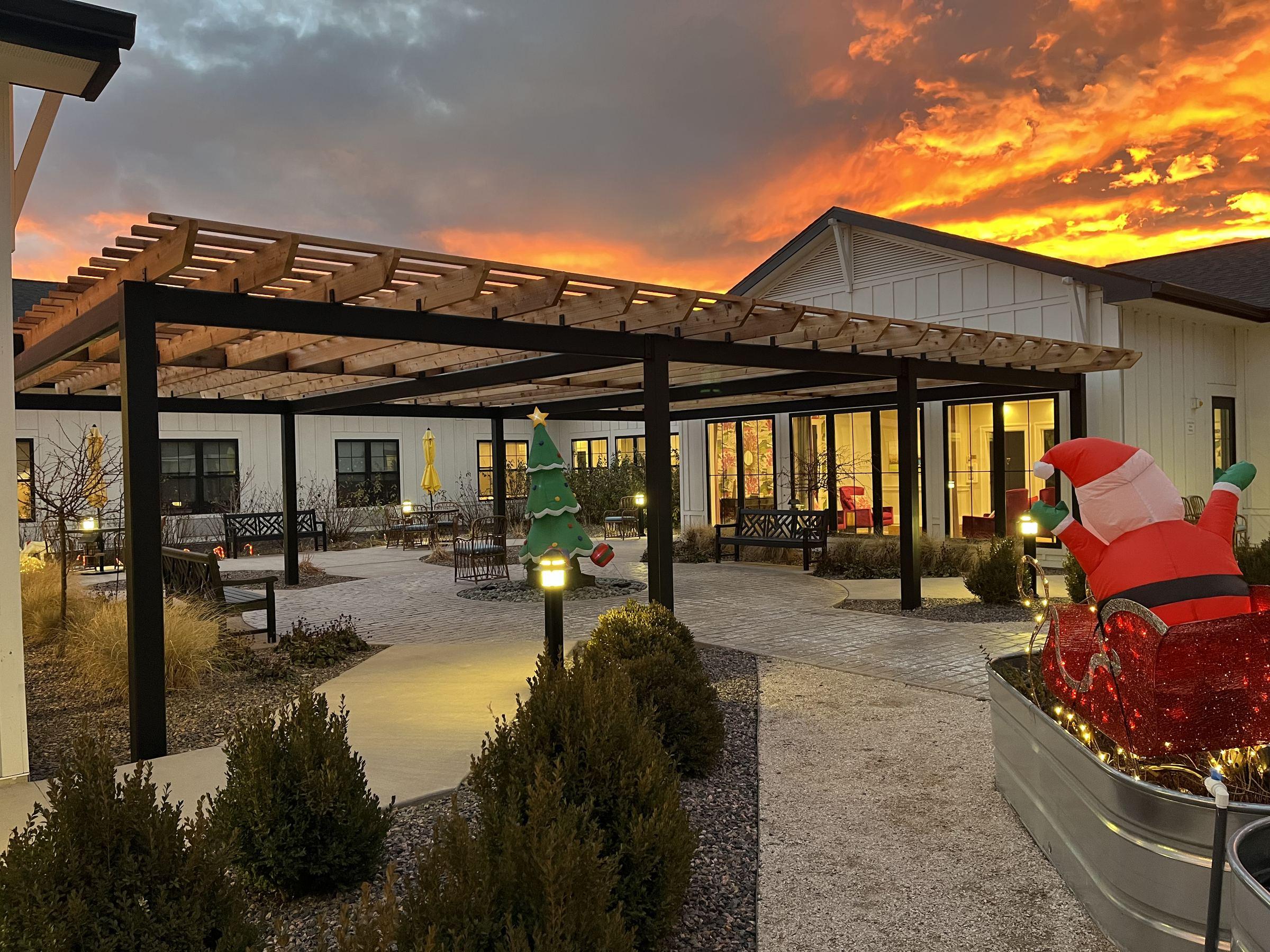 Steel-frame pergola at sunset built by AGC Deck Co